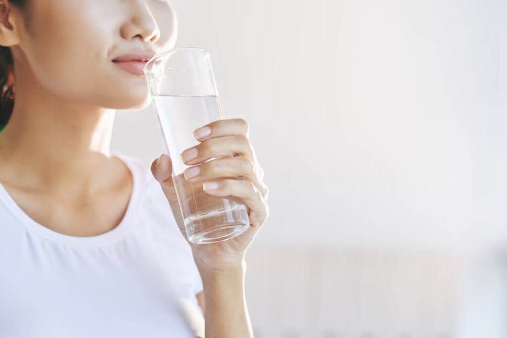 A Woman Drinking A Glass of Water